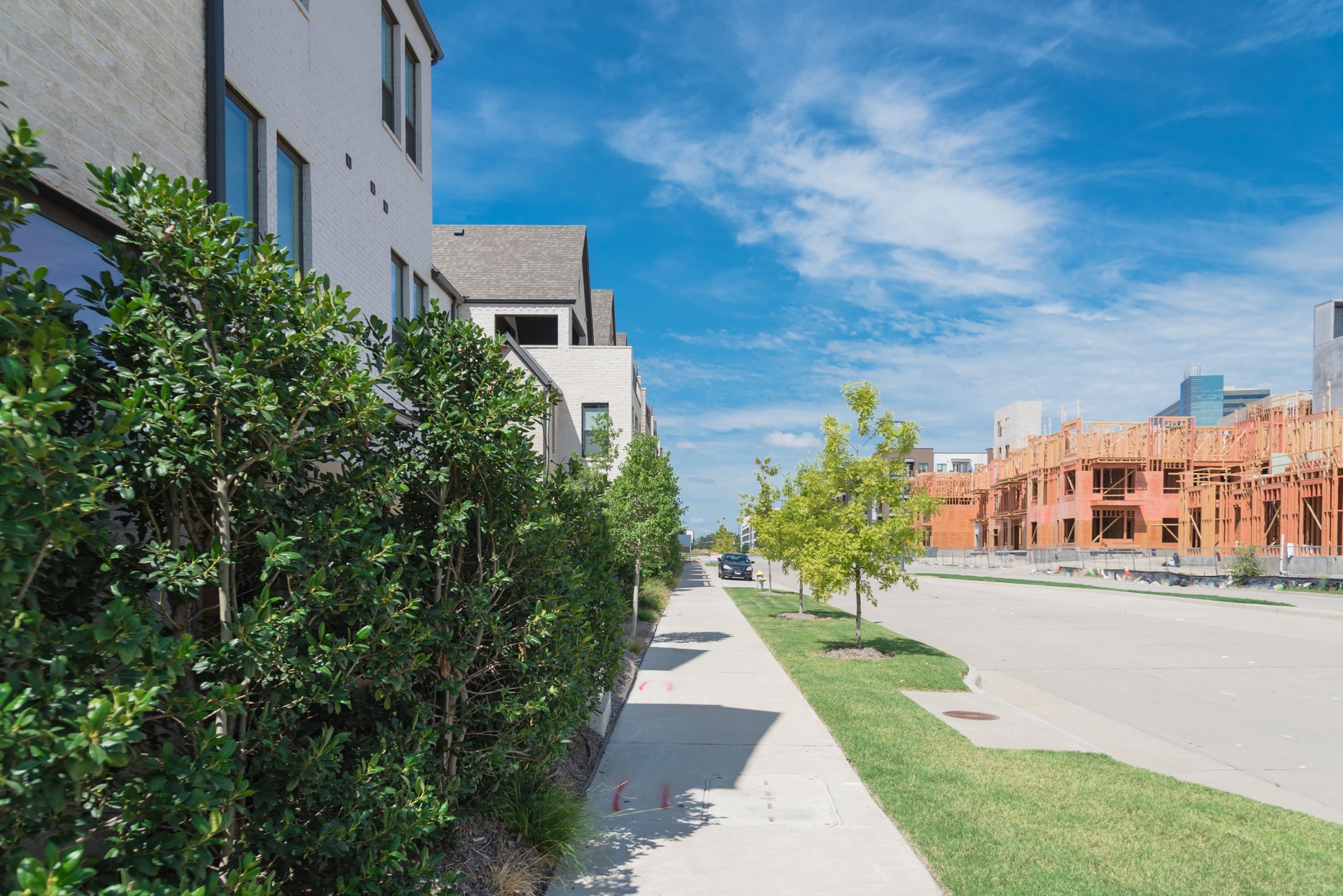 Urban upscale community with brand new residential house and apartment under construction in Dallas